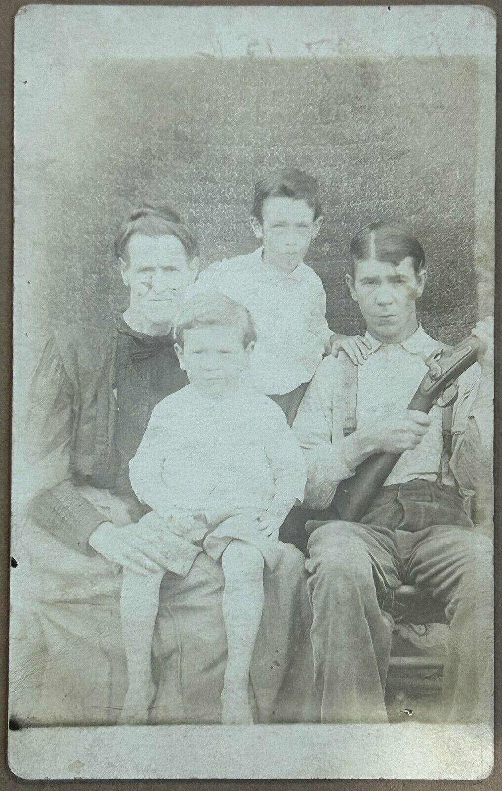 1916 Family Portrait. Man With Gun. Real Photo Postcard. RPPC.