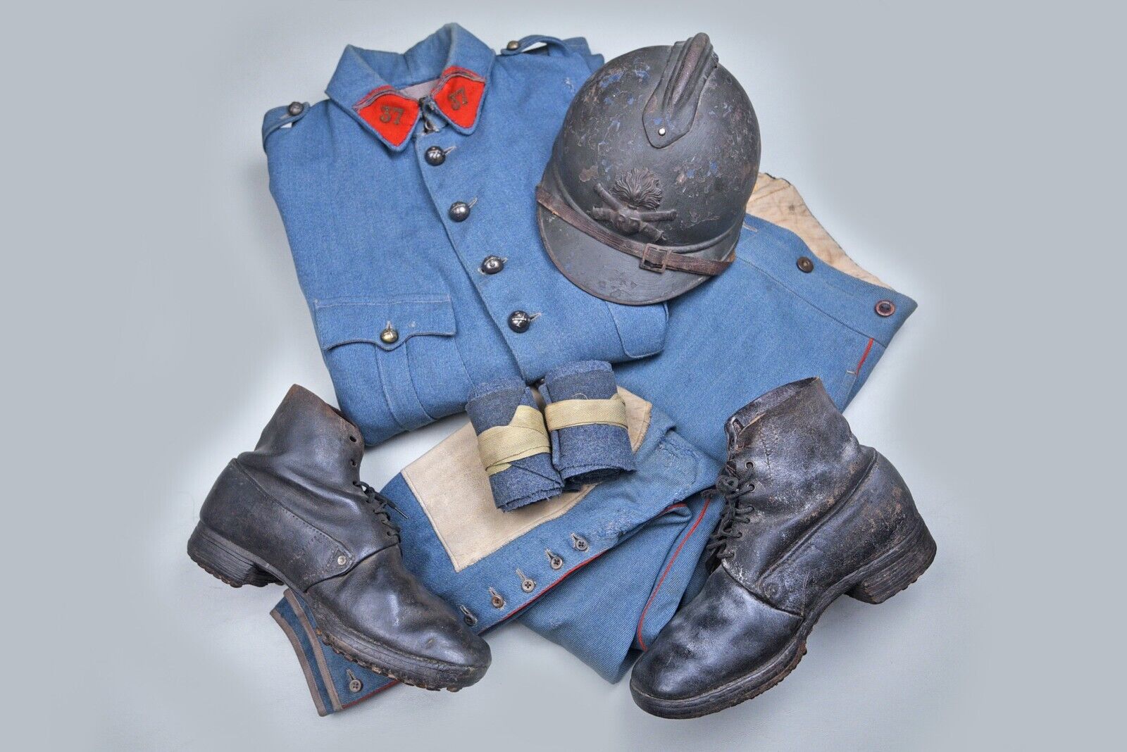 WWI FRENCH ARTILLERY UNIFORM JACKET, TROUSERS, PUTTIES, BOOTS, & HELMET GROUP