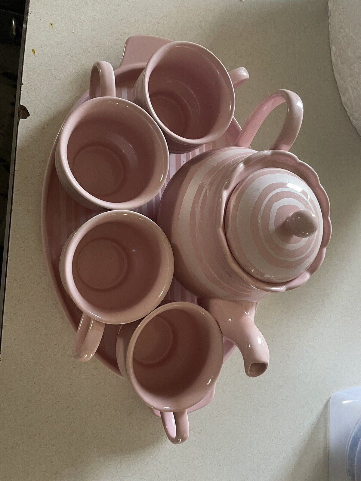 Temp-Tations 6-piece Pink Tea set, tray, 4 cups and teapot.