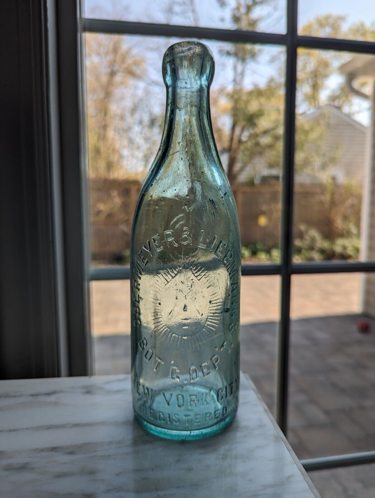 Antique Blob Top Bottle Obermeyer & Liebmann's Bot G Dep't NYC Emb Sunny Face 
