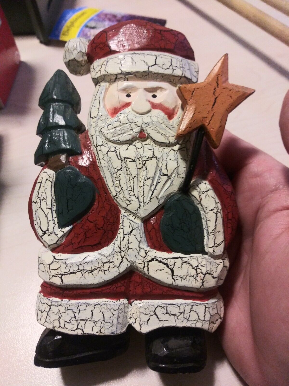 wood carved Santa Claus with Christmas tree and star