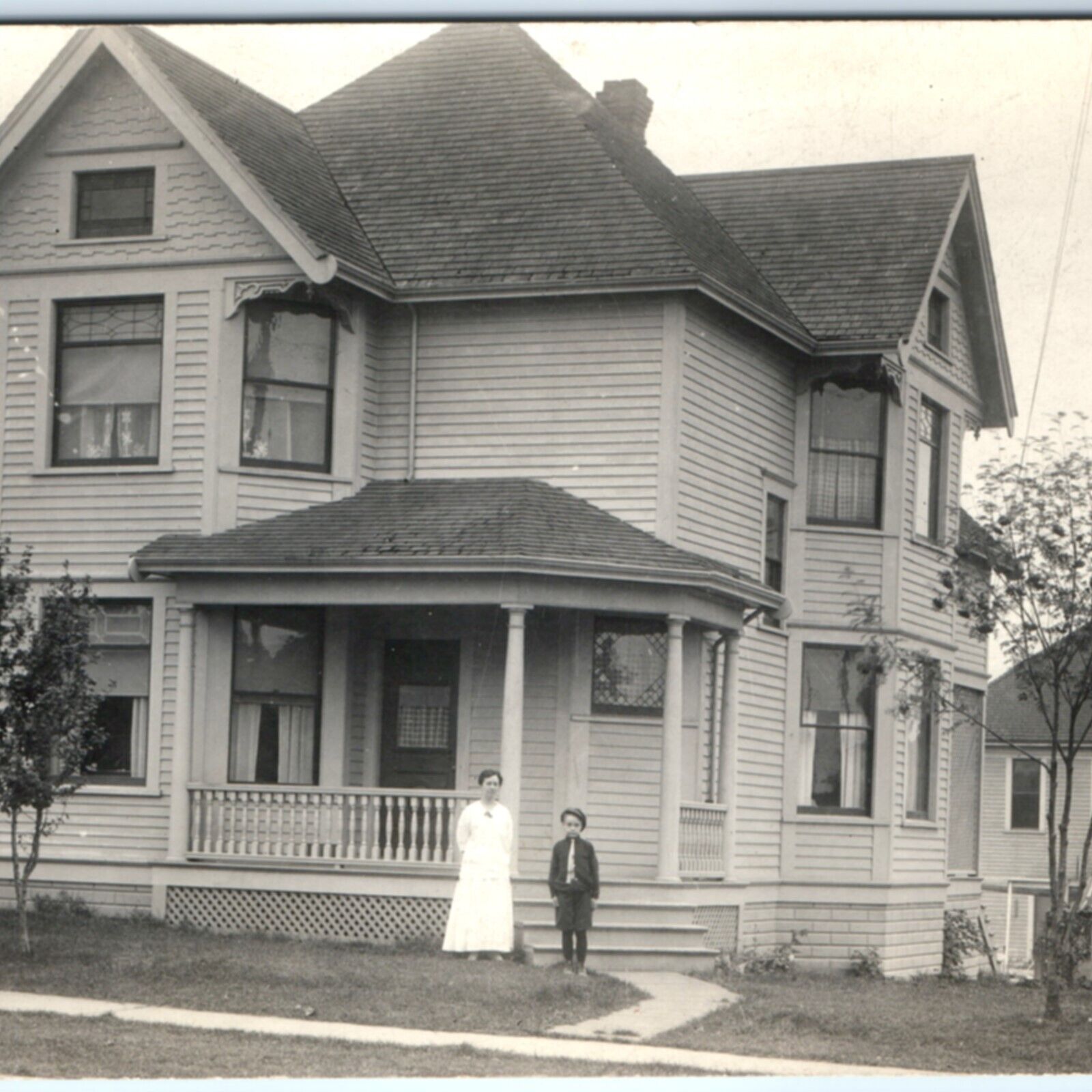 c1910s Beautiful House in Town RPPC Mother Son? Woodwork Trim Real Photo PC A133