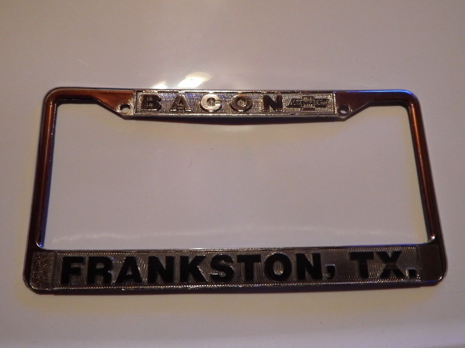Bacon Frankston TX License Plate Frame Embossed Tag Vintage Metal Chevrolet GM