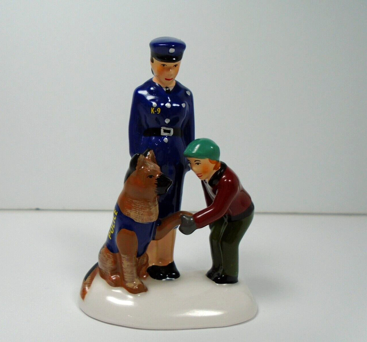 DEPARTMENT 56 SNOW VILLAGE SHAKEDOWN POLICEWOMAN WITH K-9 AND BOY