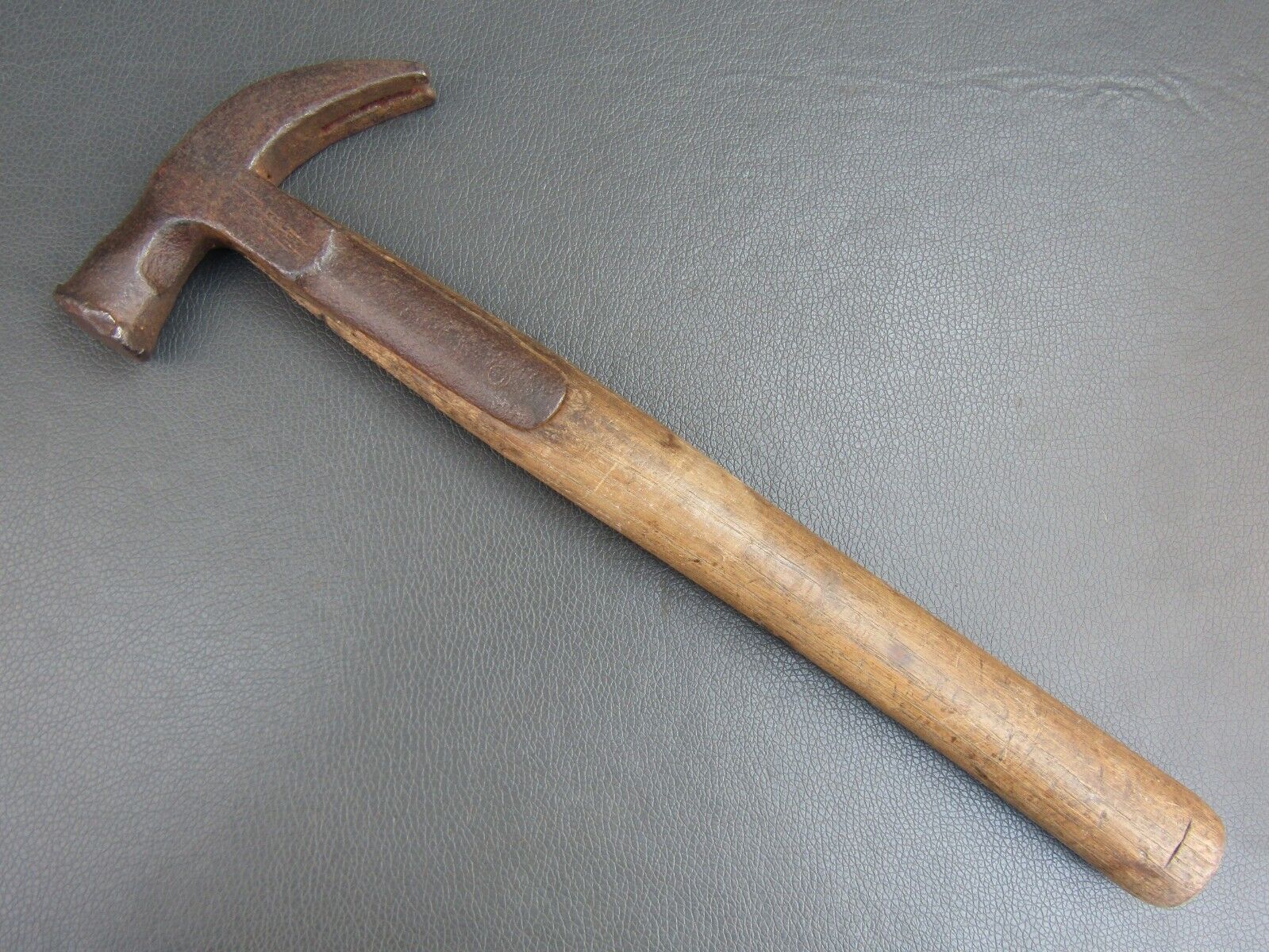 Vintage strapped claw hammer old tool