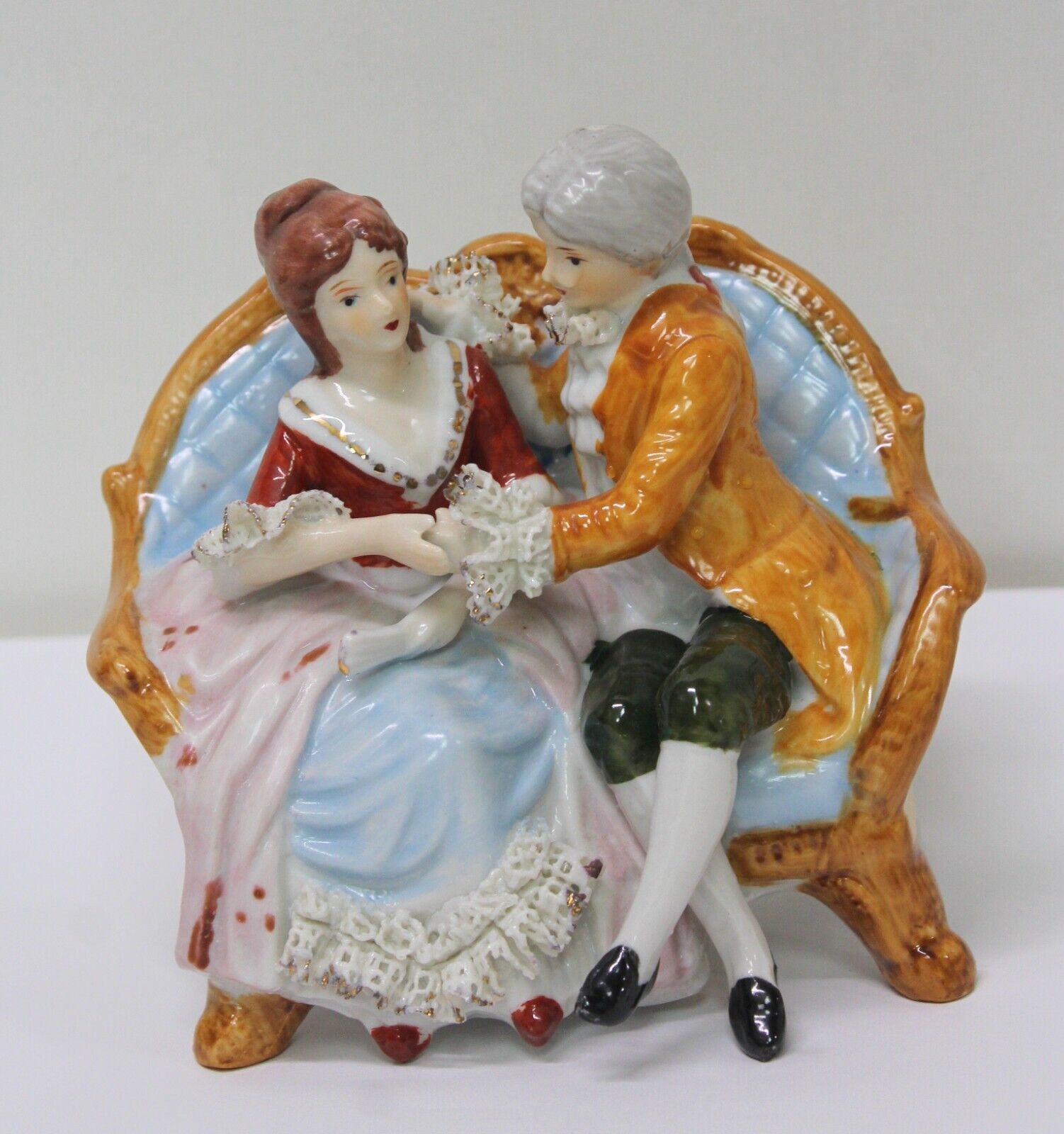 Vintage Ceramic Figurine Victorian Couple Sitting on a Couch