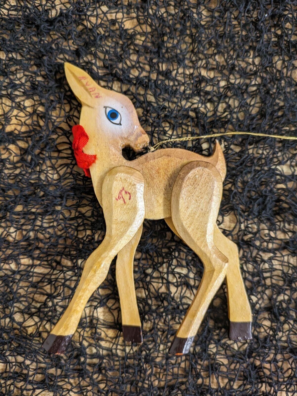 Vtg. carved deer and painted Christmas ornament.