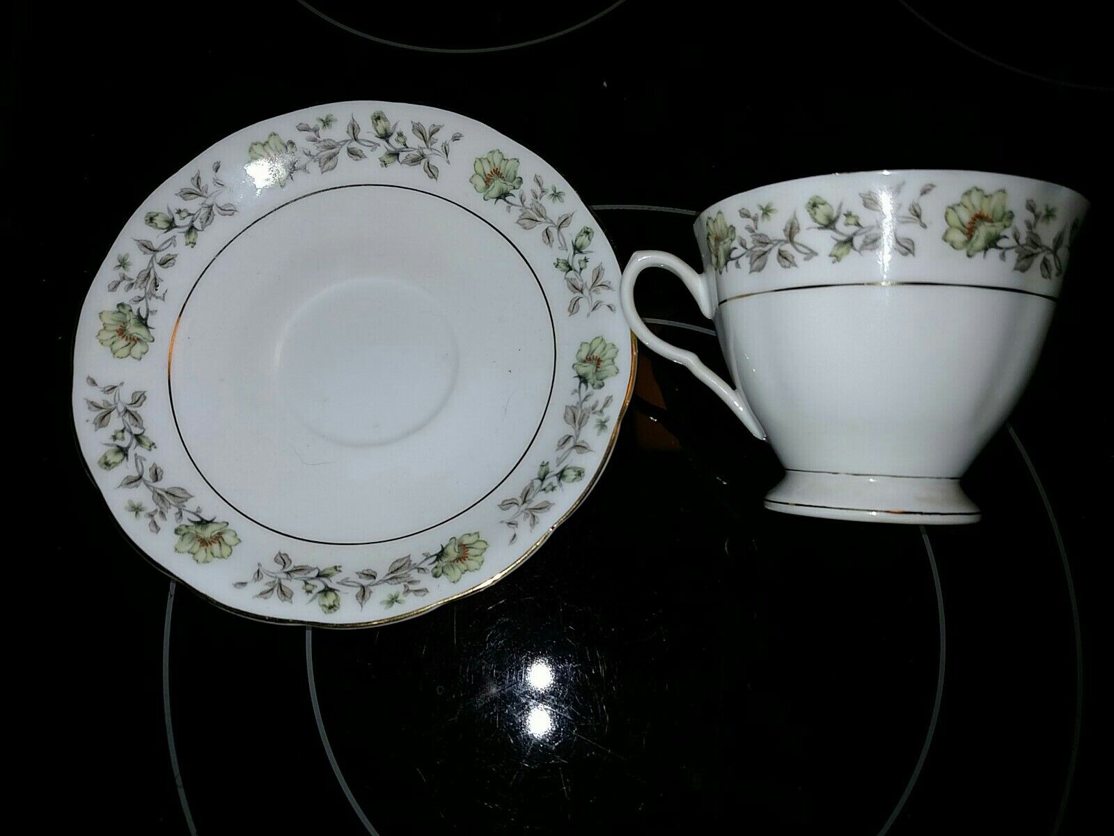 VINTAGE TEA CUP & SAUCER SET WHITE WITH GREENS & GOLD TRIM MADE IN CHINA W/ MARK