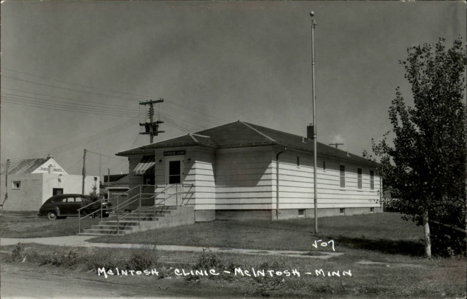 RPPC McIntosh Minnesota Clinic ~ vintage car ~ Kodak real photo postcard