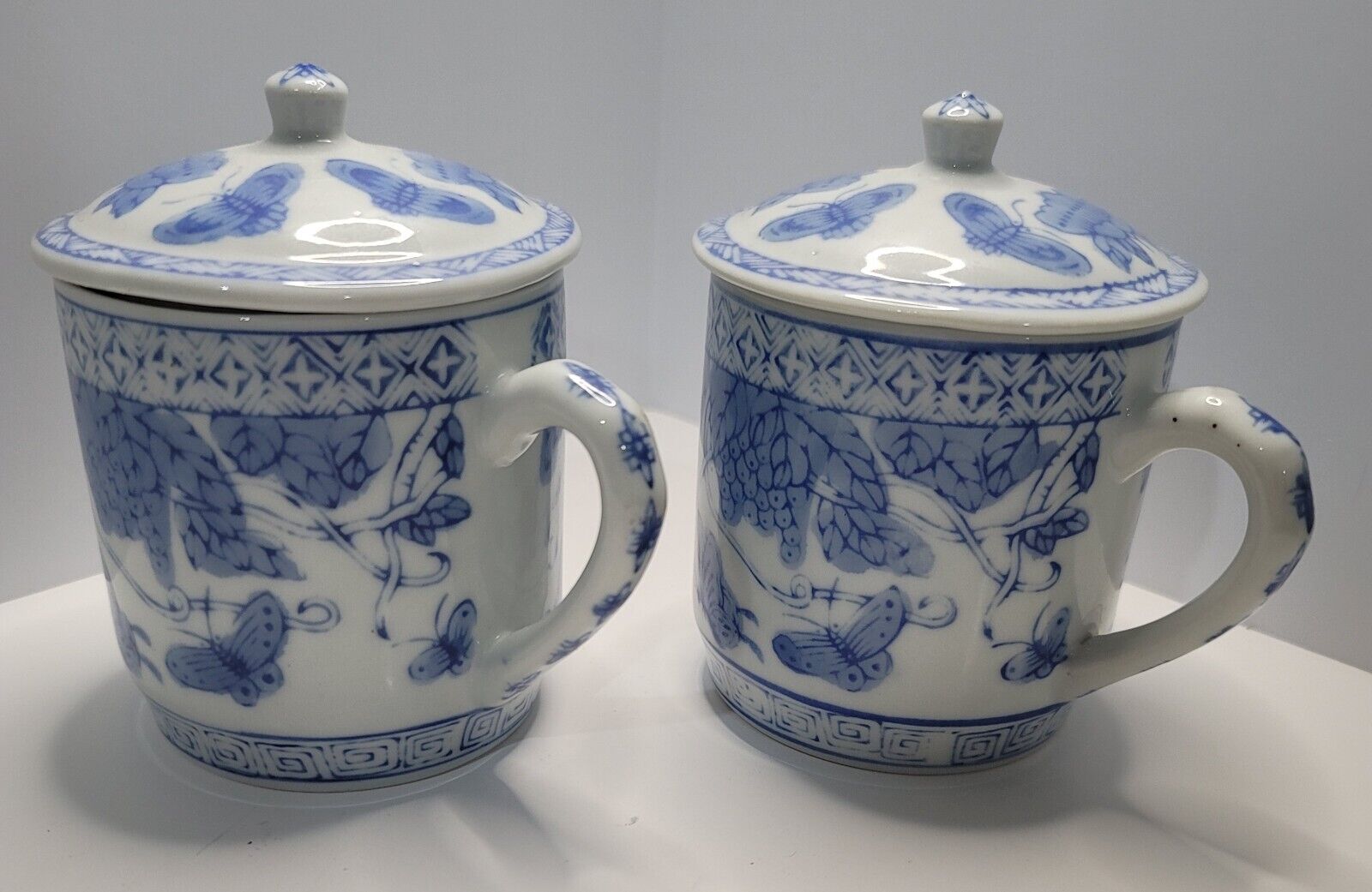 Set Of (2) Oriental Porcelain BLUE & WHITE Mug with Lid Butterflies Grapevines