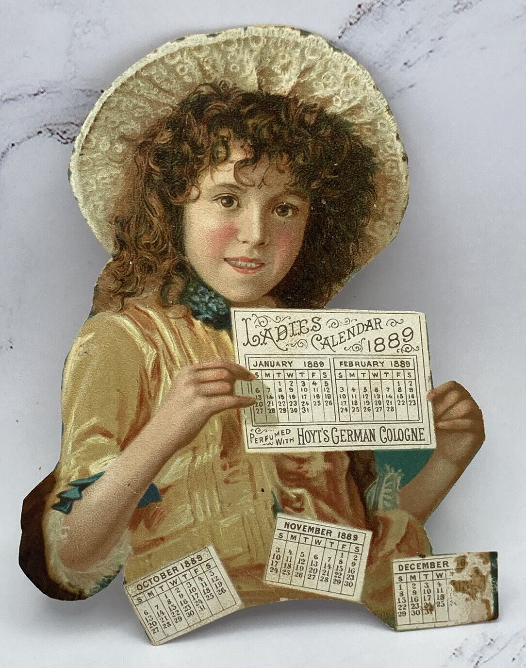 Girl Holds Ladies Calendar 1889 ANTIQUE Cutout Hoyt\'s German Cologne & Rubifoam