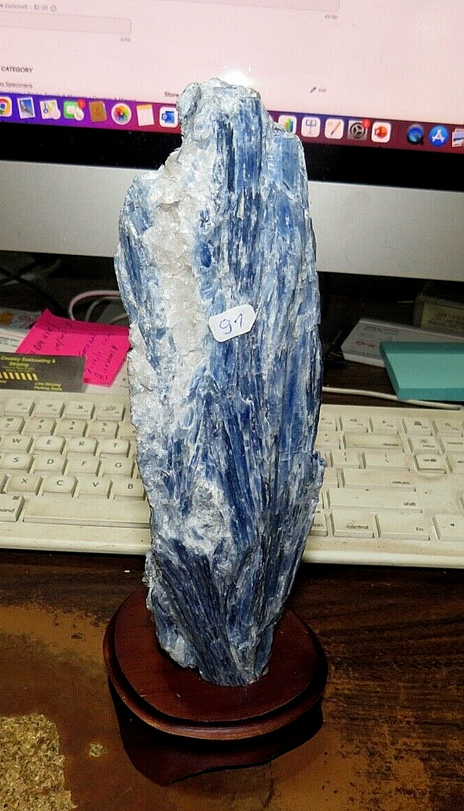 GORGEOUS SPECIMEN OF BLUE KYANITE IN A WOOD STAND