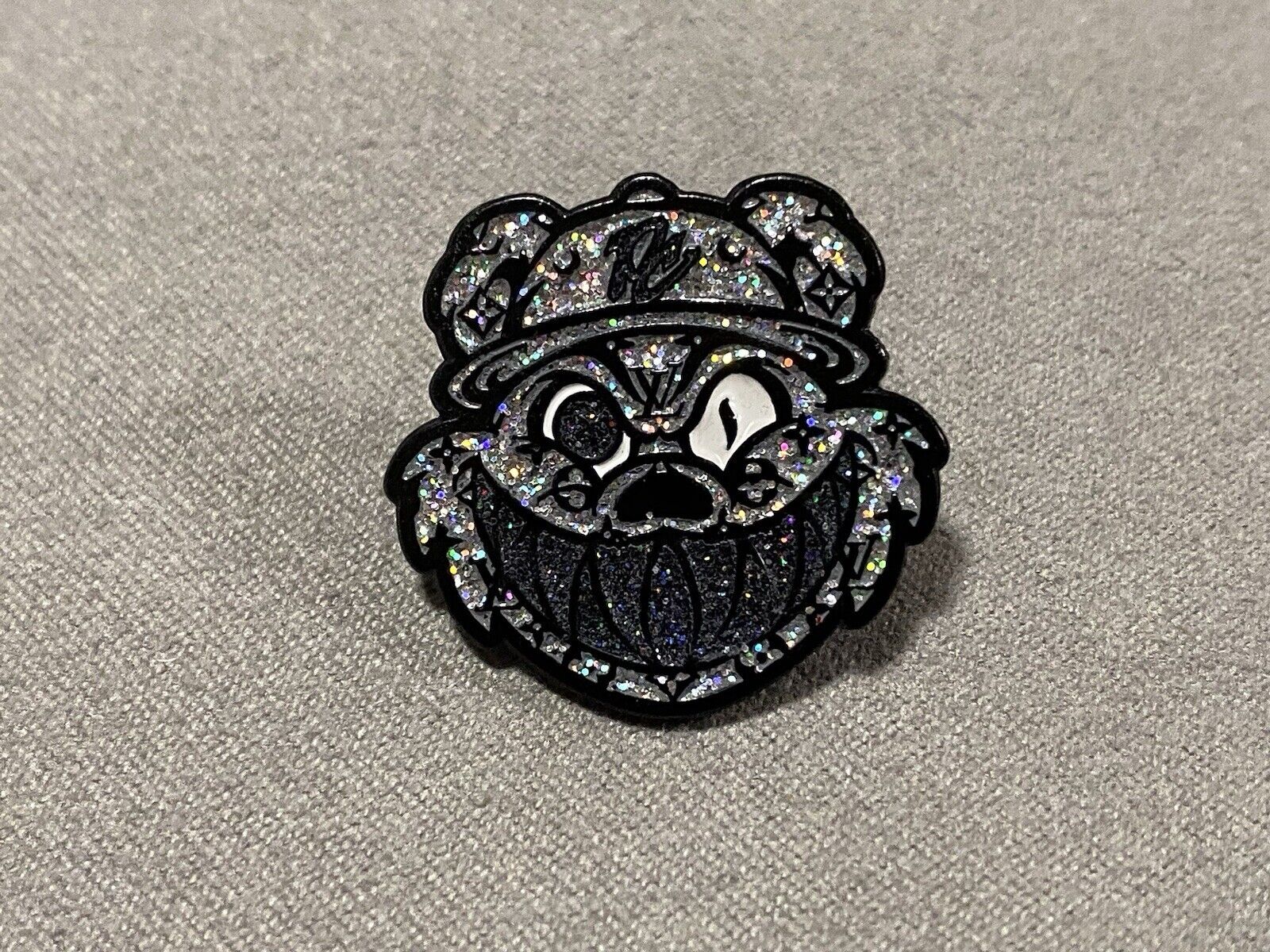Pinzcity Louis Vuitton Silver Multi Black Grill Glitter Scare Bear Hat Pin