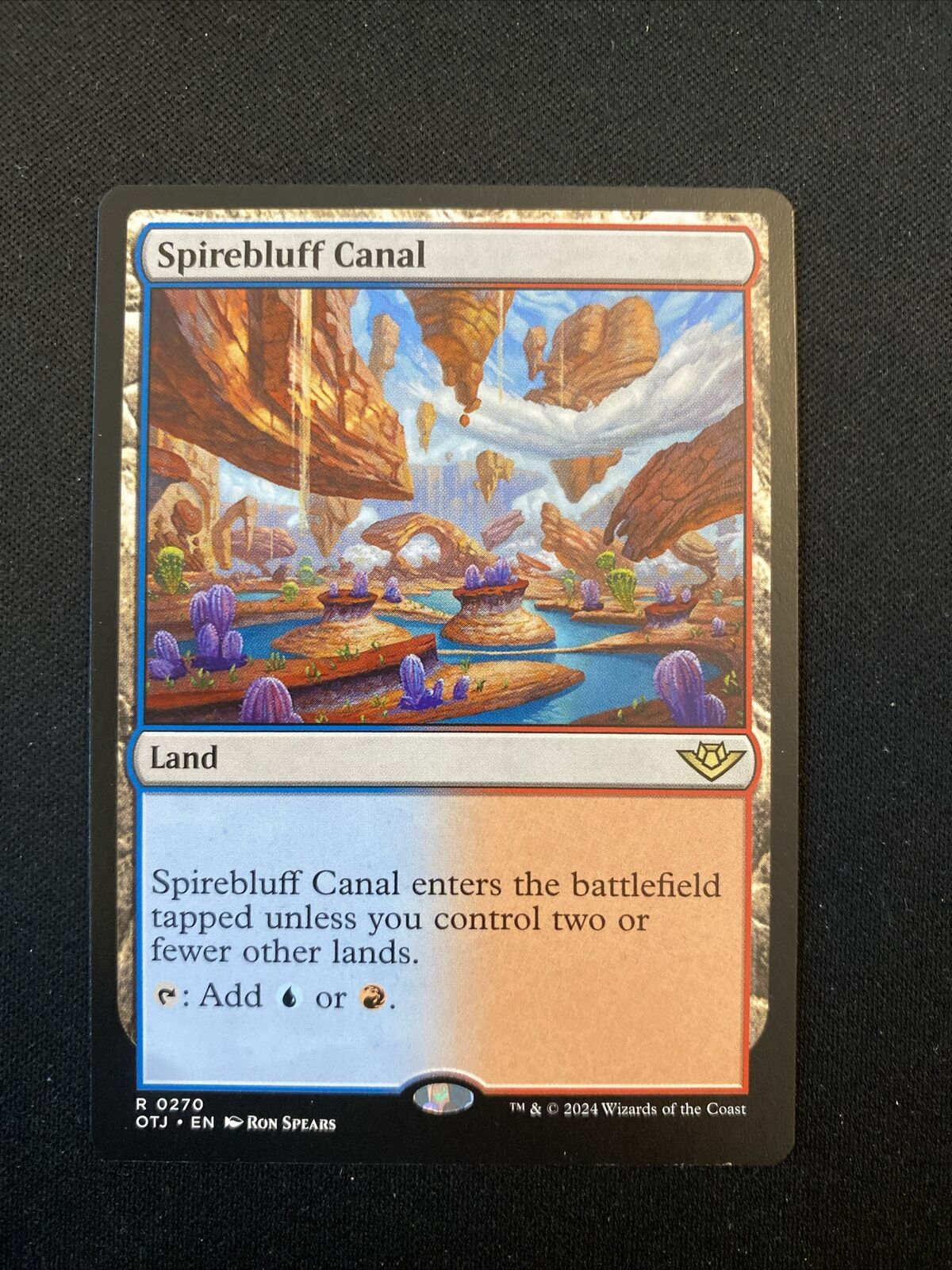 Spirebluff Canal - Outlaws of Thunder Junction (MTG)