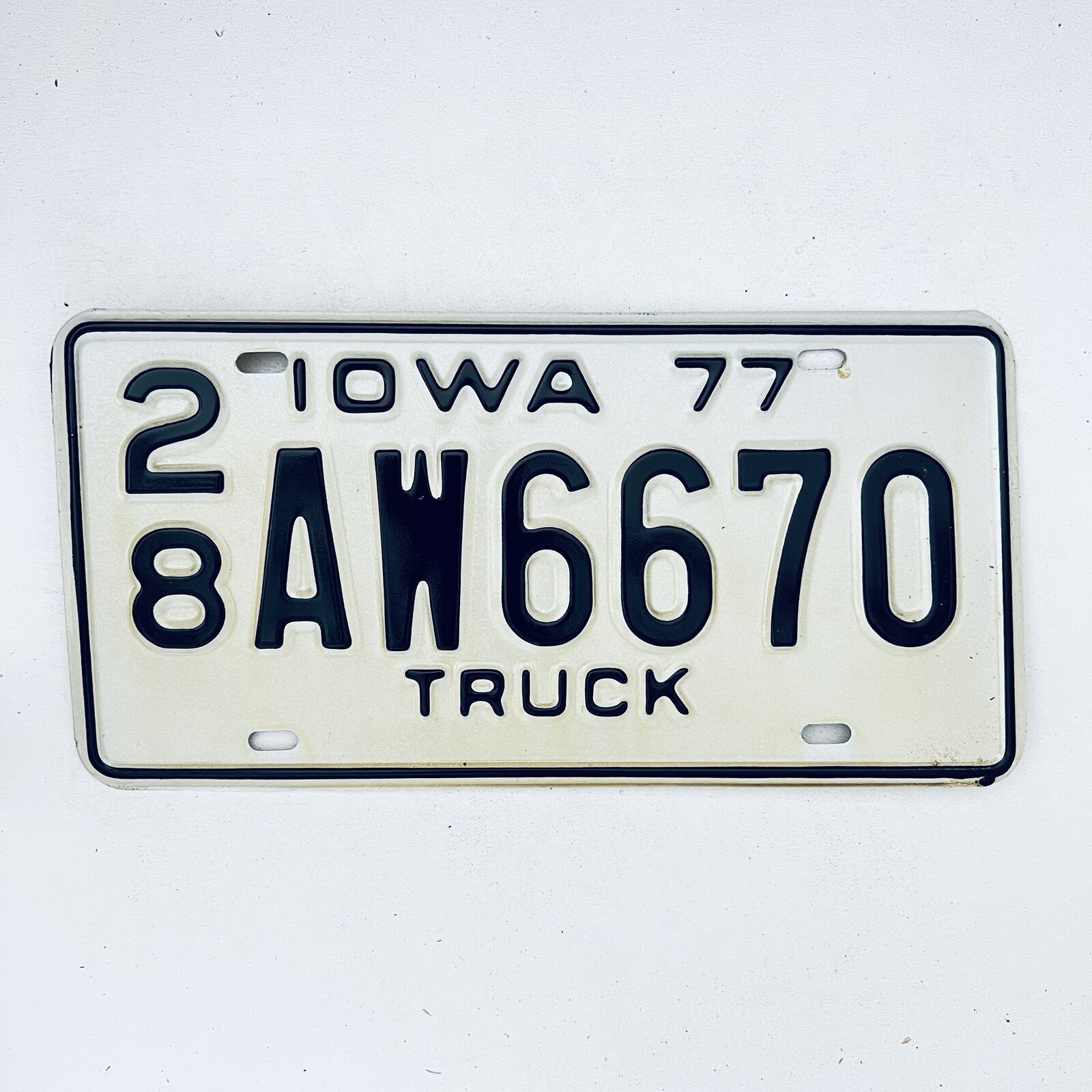 1977 United States Iowa Delaware County Passenger License Plate 28 AW6670
