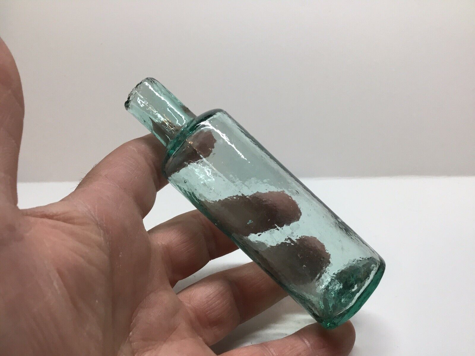 Small Squatty Antique Cylinder Burst Top Medicine Bottle.