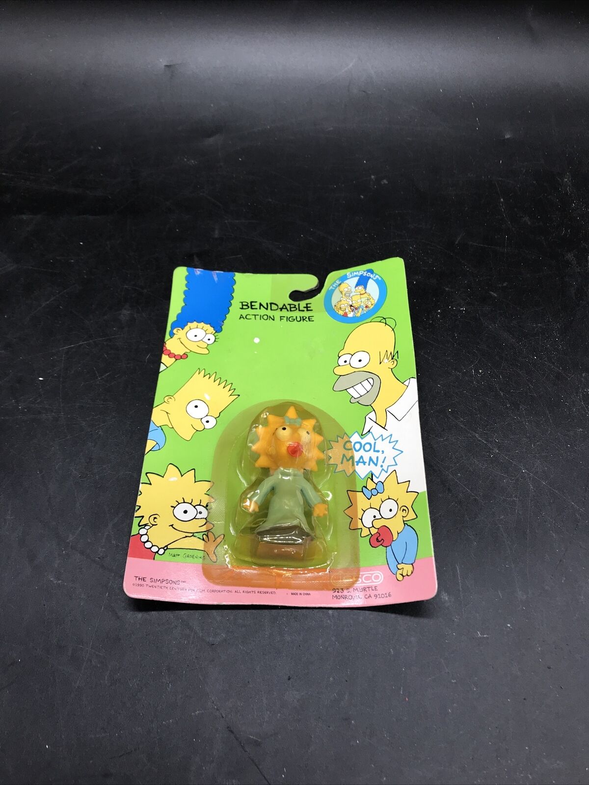 The Simpsons 1990 Maggie PVC Action Figure On Card.  Pre  Owned