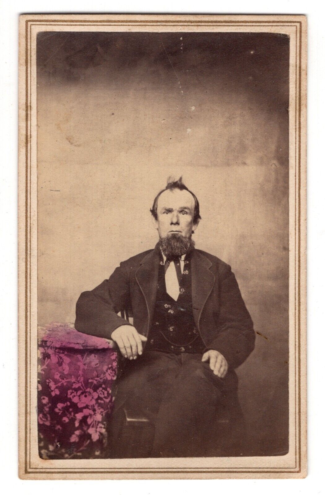 CIRCA 1860s CDV BEARDED MAN IN SUIT SITTING IN CHAIR HAND-TINTED UNMARKED