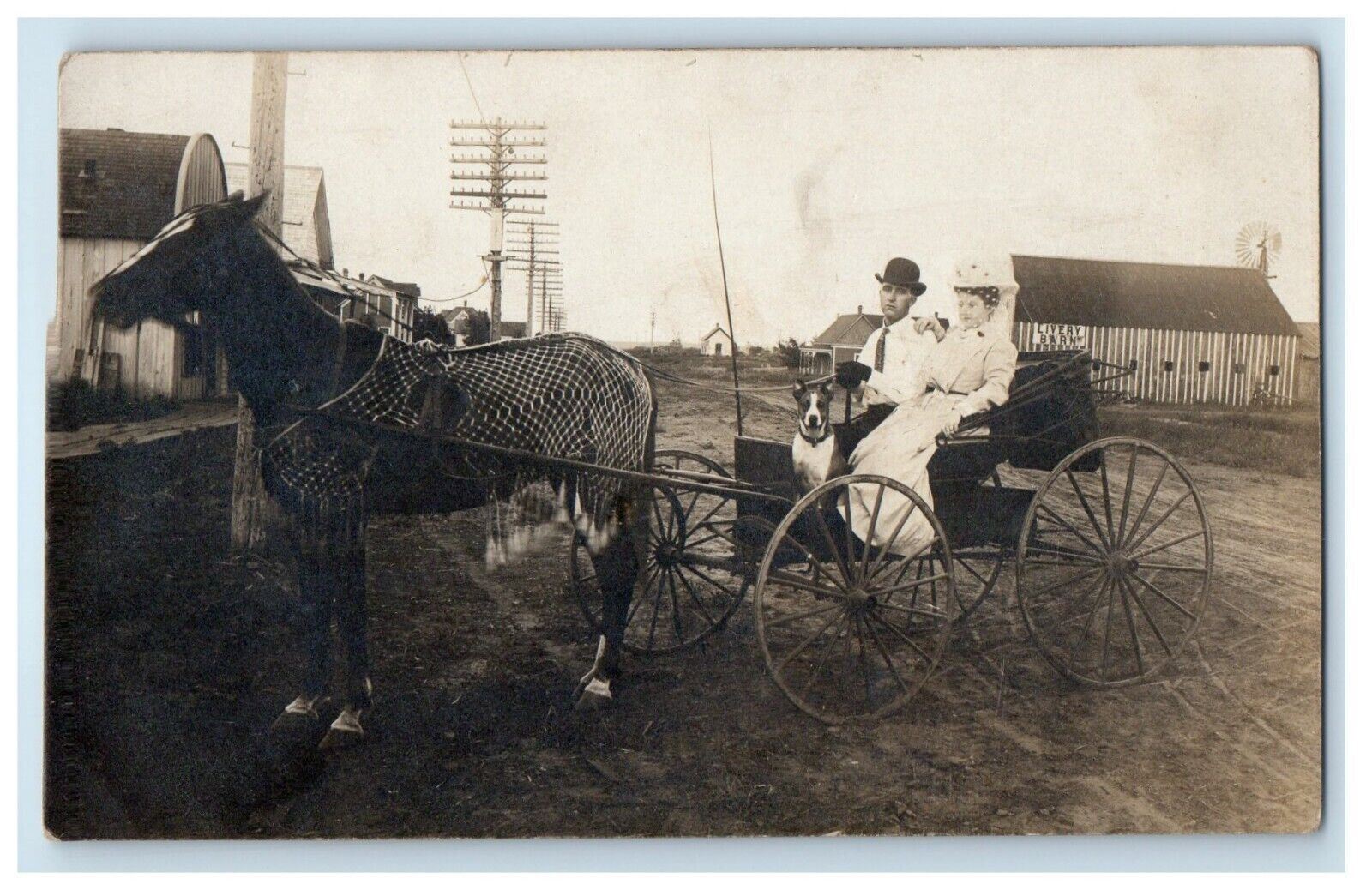 c1910 Family Wagon Horse Dog Livery Barn Windmill Carriage RPPC Photo Postcard