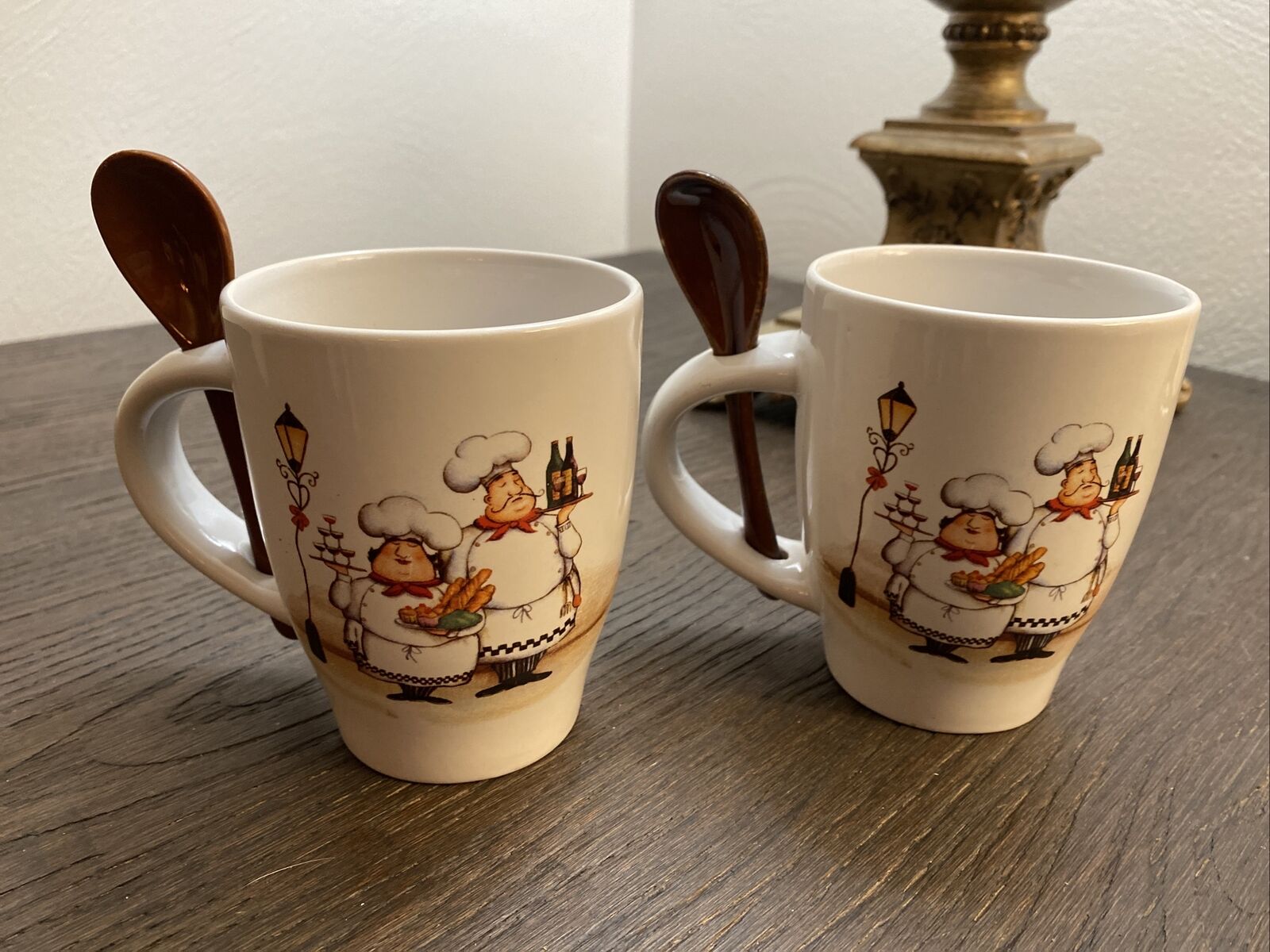 2 italian mugs.  picture of italian man and woman. TRIS CO.  Stir Spoon Attached