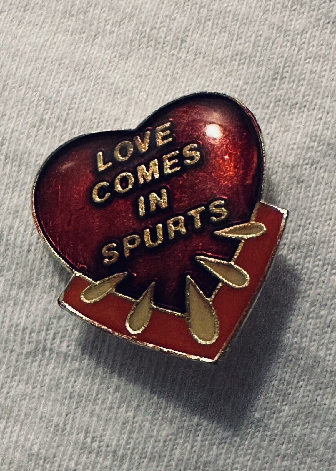 Vintage 1980s Enamel Risqué Novelty Pin “Love Comes in Spurts”