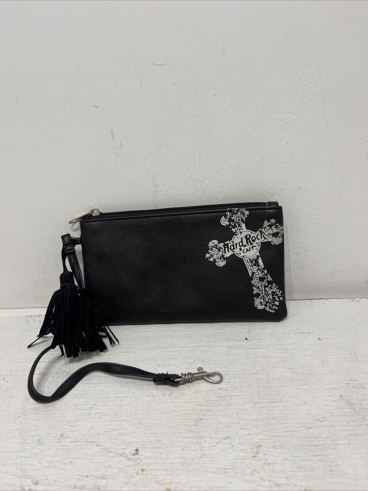 Preowned Authentic Hard Rock Cafe Black Wristlet Faux Leather Cross Tassel