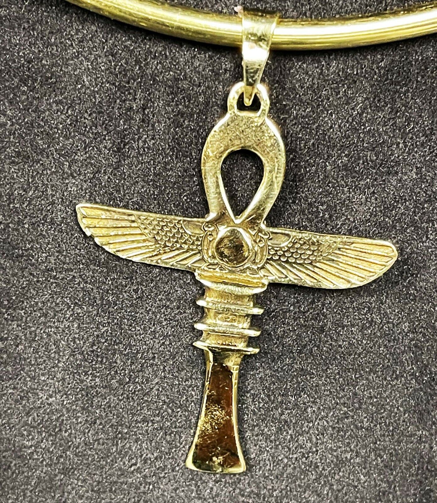 Amulet of Egyptian Ankh With Wings of protection and Sun symbol and Djed