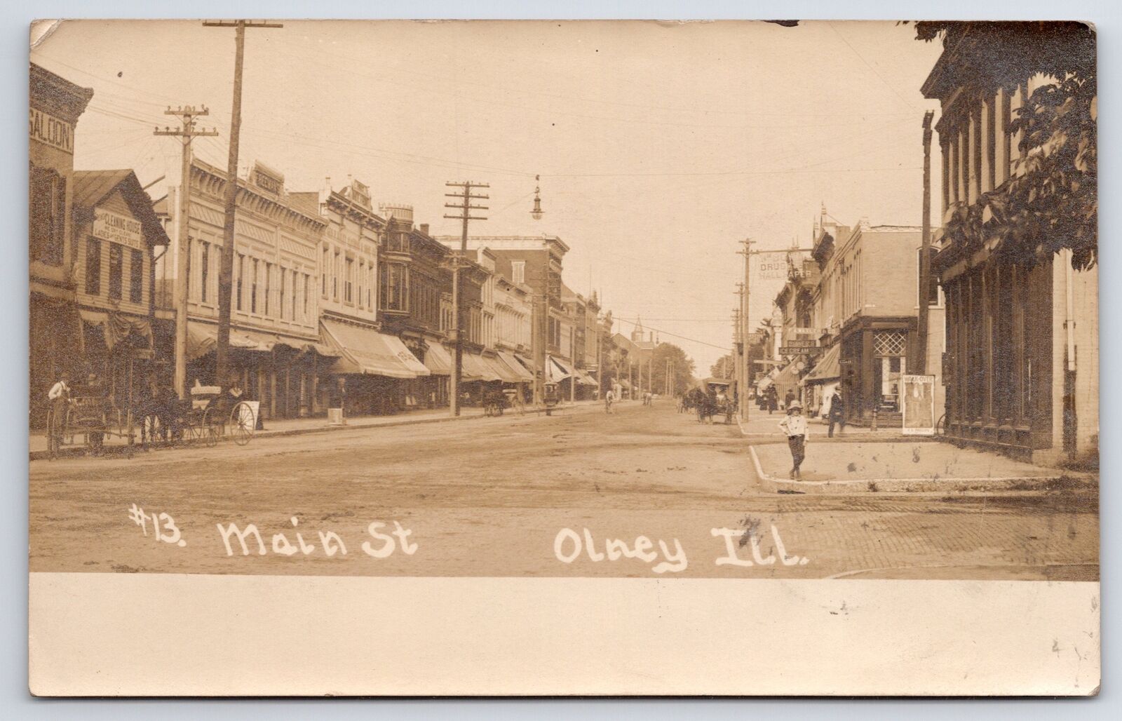 Olney Illinois~Main Street~Dry Cleaner~Girl Strikes A Pose On Corner~1908 RPPC