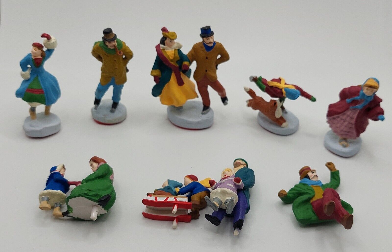 VINTAGE Mr Christmas Holiday Skaters Victorian 9 Ice skaters Ex Condition