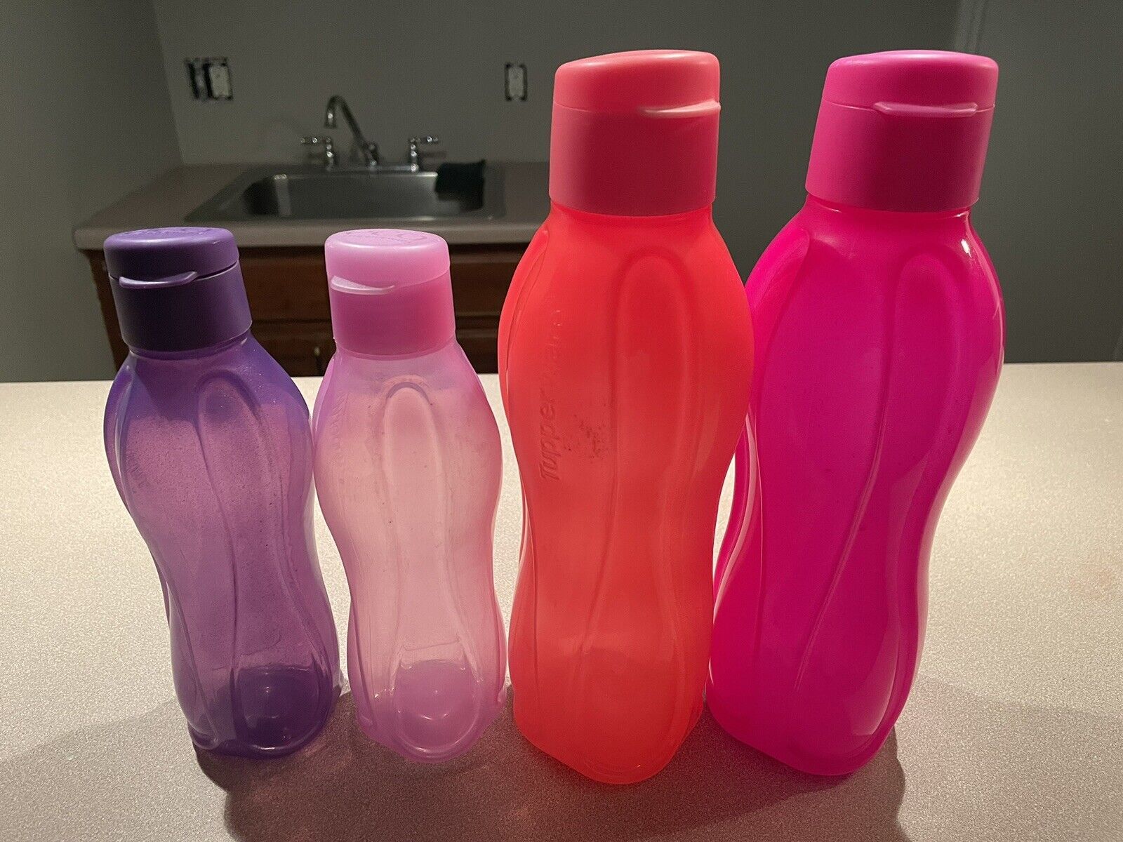 Tupperware Eco Reusable water bottle set of 4. (Two 16oz. , Two 34oz.)