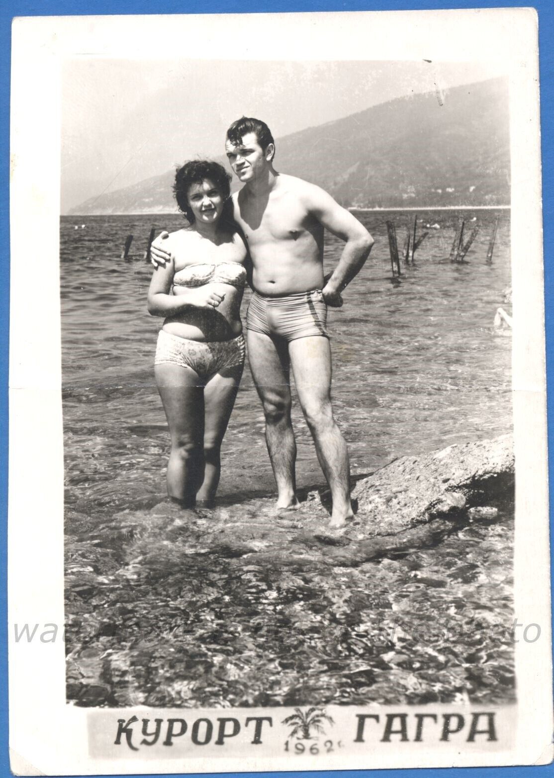 Beautiful man and woman on the beach Vintage photo