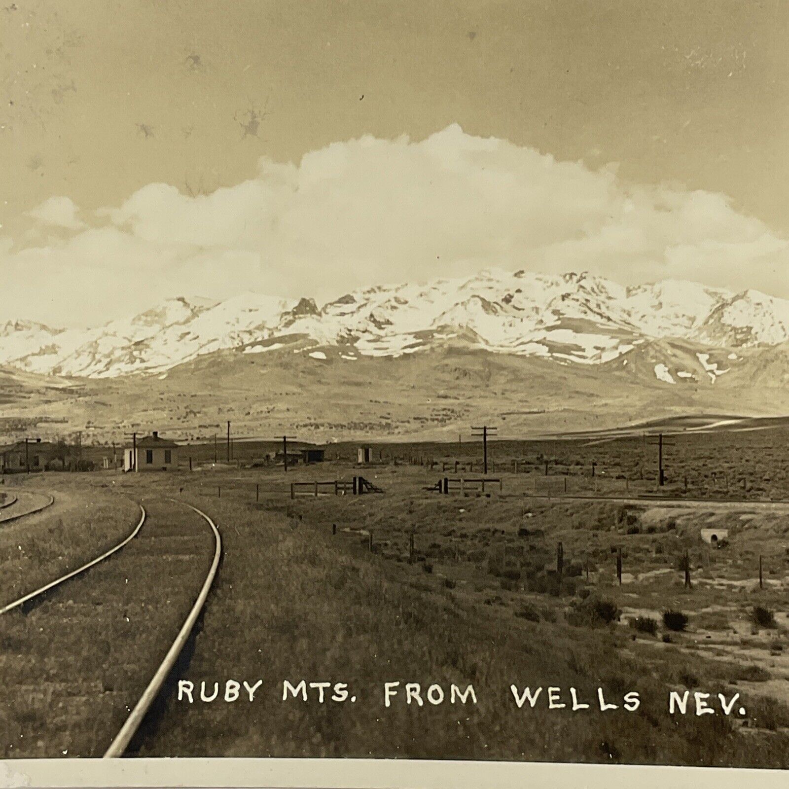 Early Ruby Mountains, Wells Nevada Real Photo Postcard RPPC Railroad Tracks