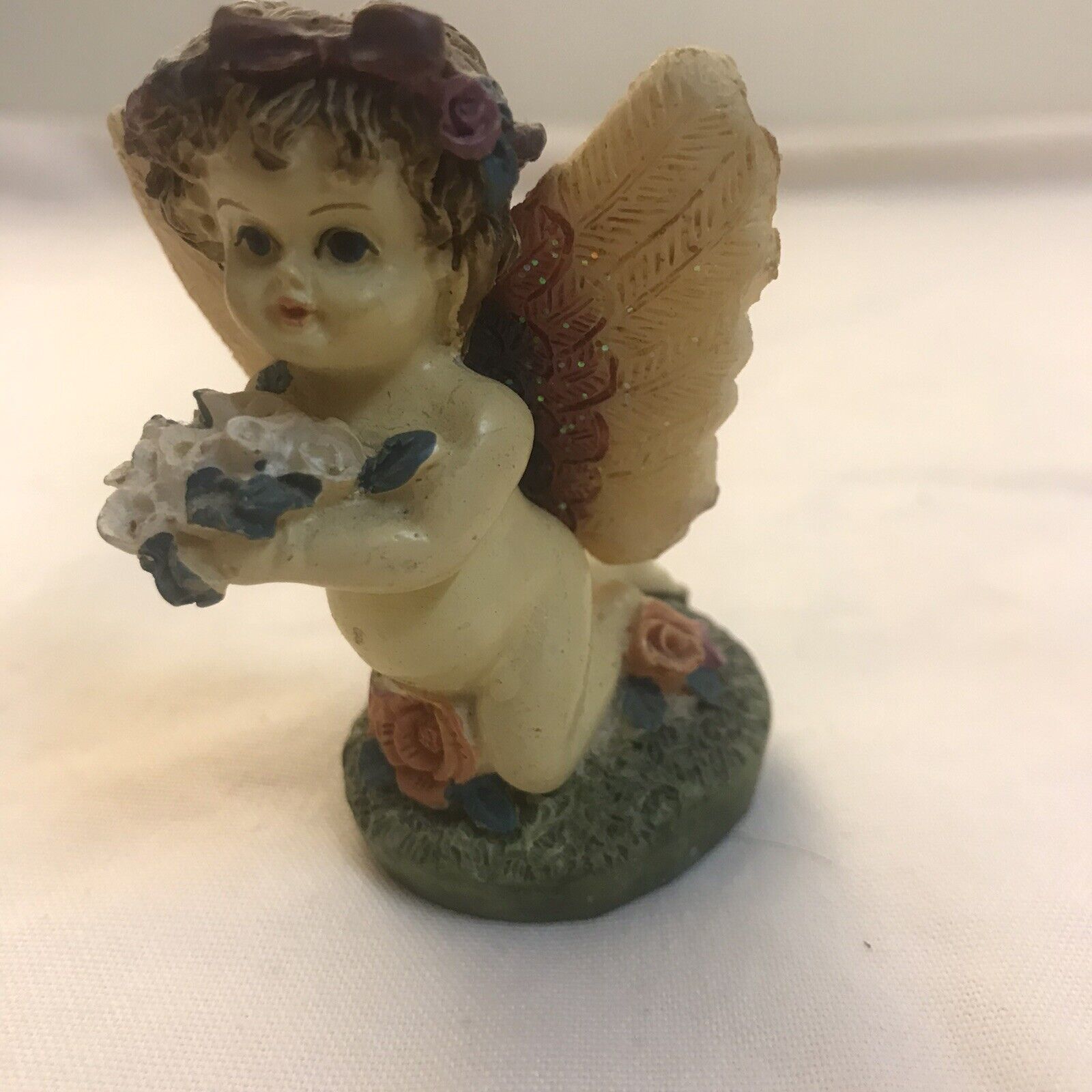 Cute Small Cupid Figurine With Wings And Bouquet Flowers