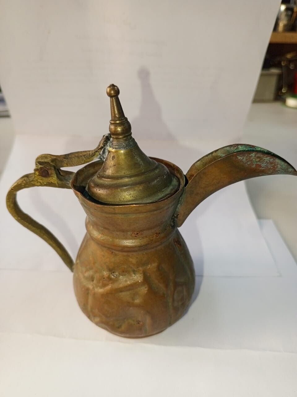 A small size coffee pot, very old, antique copper