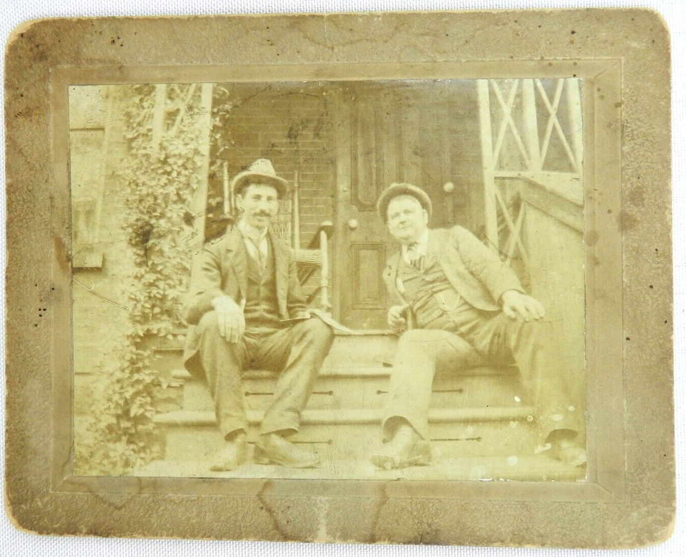 Two Men in Suit with Ties, and Hat Sit on Stairs to Porch - c.1900s Cabinet Card