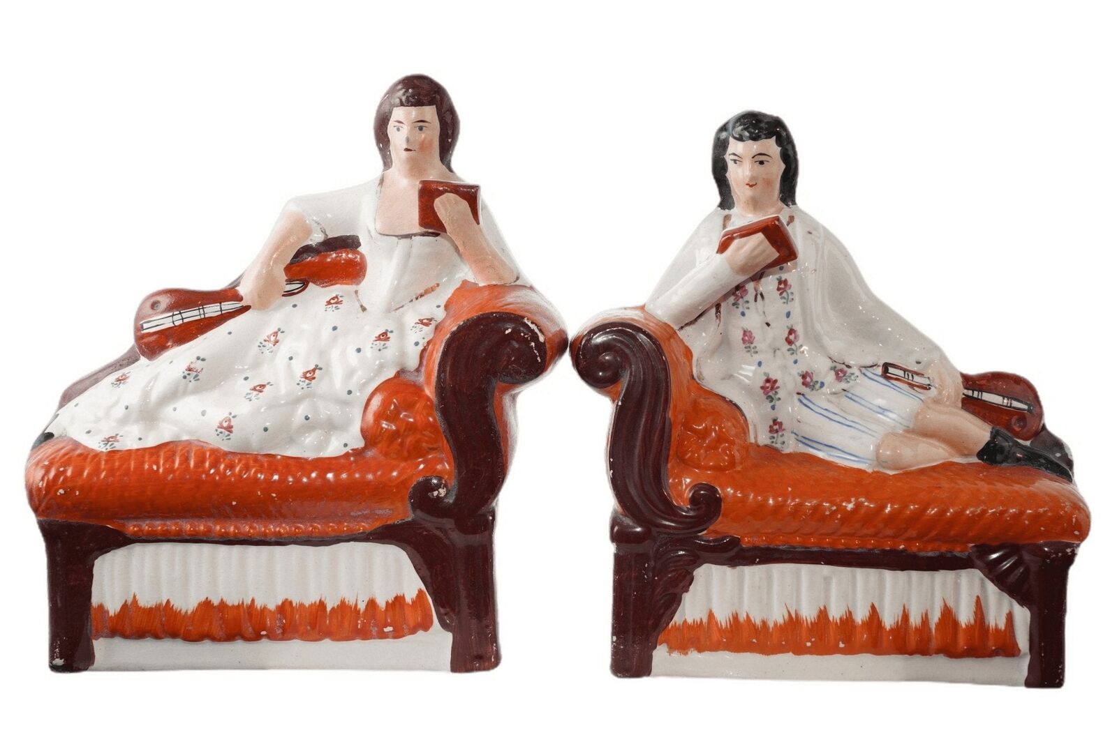 Antique Staffordshire Bookends Man and Woman reclining on sofa
