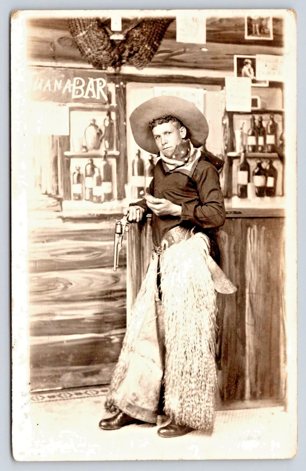 Postcard RPPC 1928 Tiajuana Bar Handsome Cowboy in Fuzzy Chaps with Gun A16