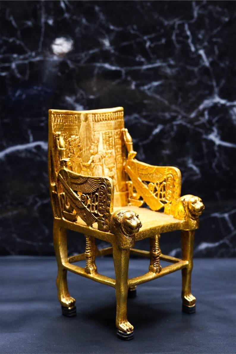 Golden King Tutankhamun's Throne with Sekhmet goddess head - King Tutankhamun