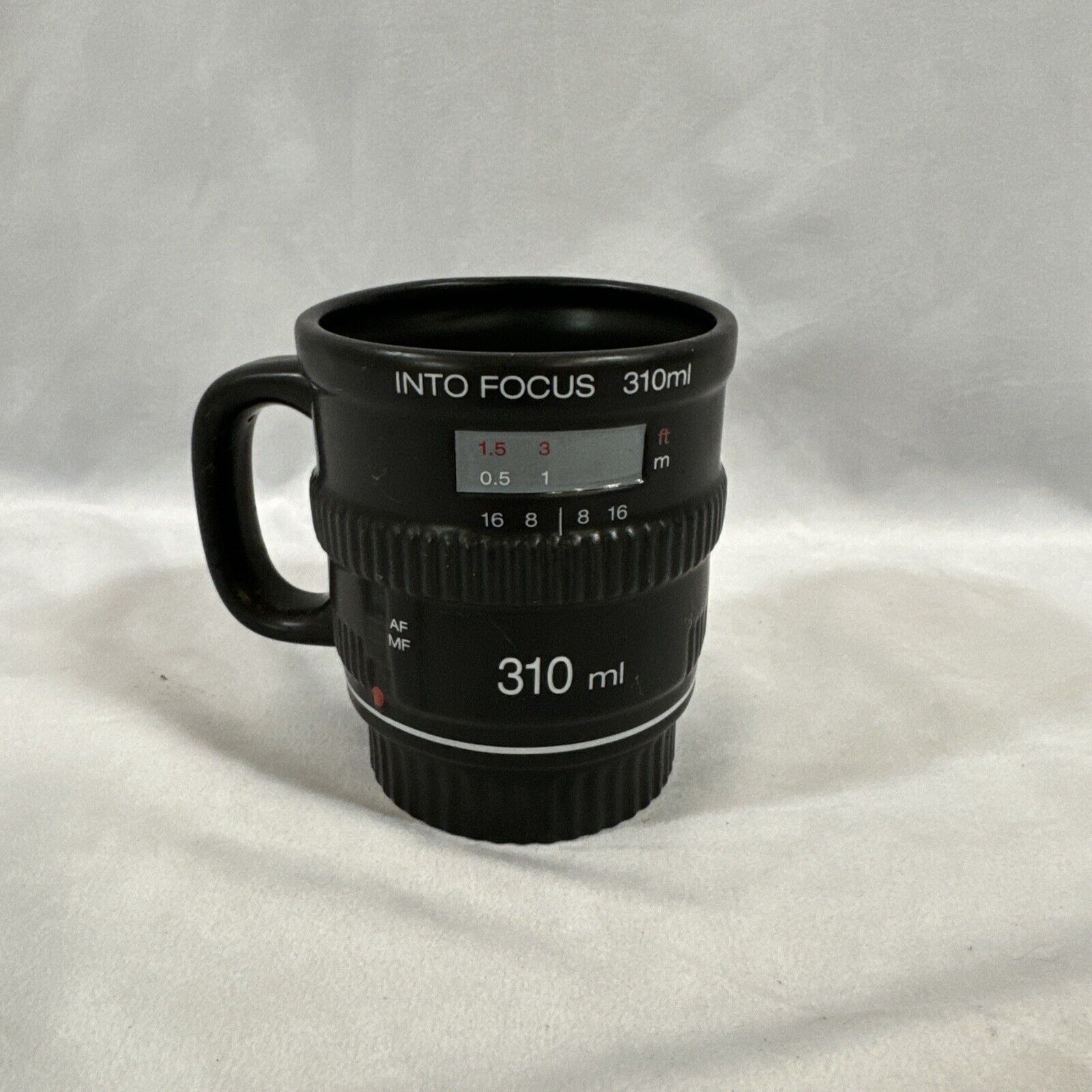 Into Focus ceramic coffee mug Bitten camera lens design