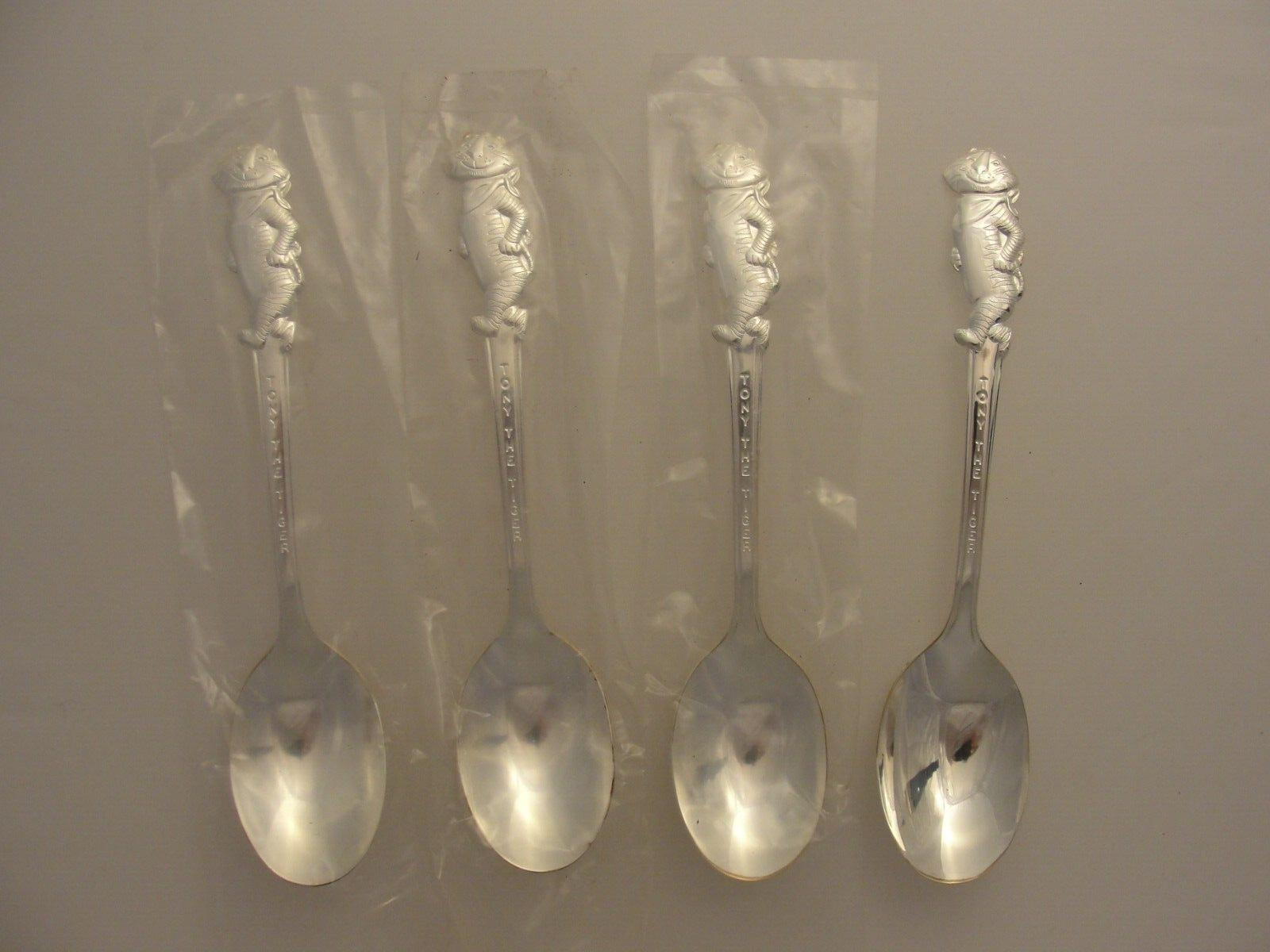 4 VTG KELLOGG TONY THE TIGER SILVER PLATE SPOONS 1965 NEW OLD STOCK  LOT * 91