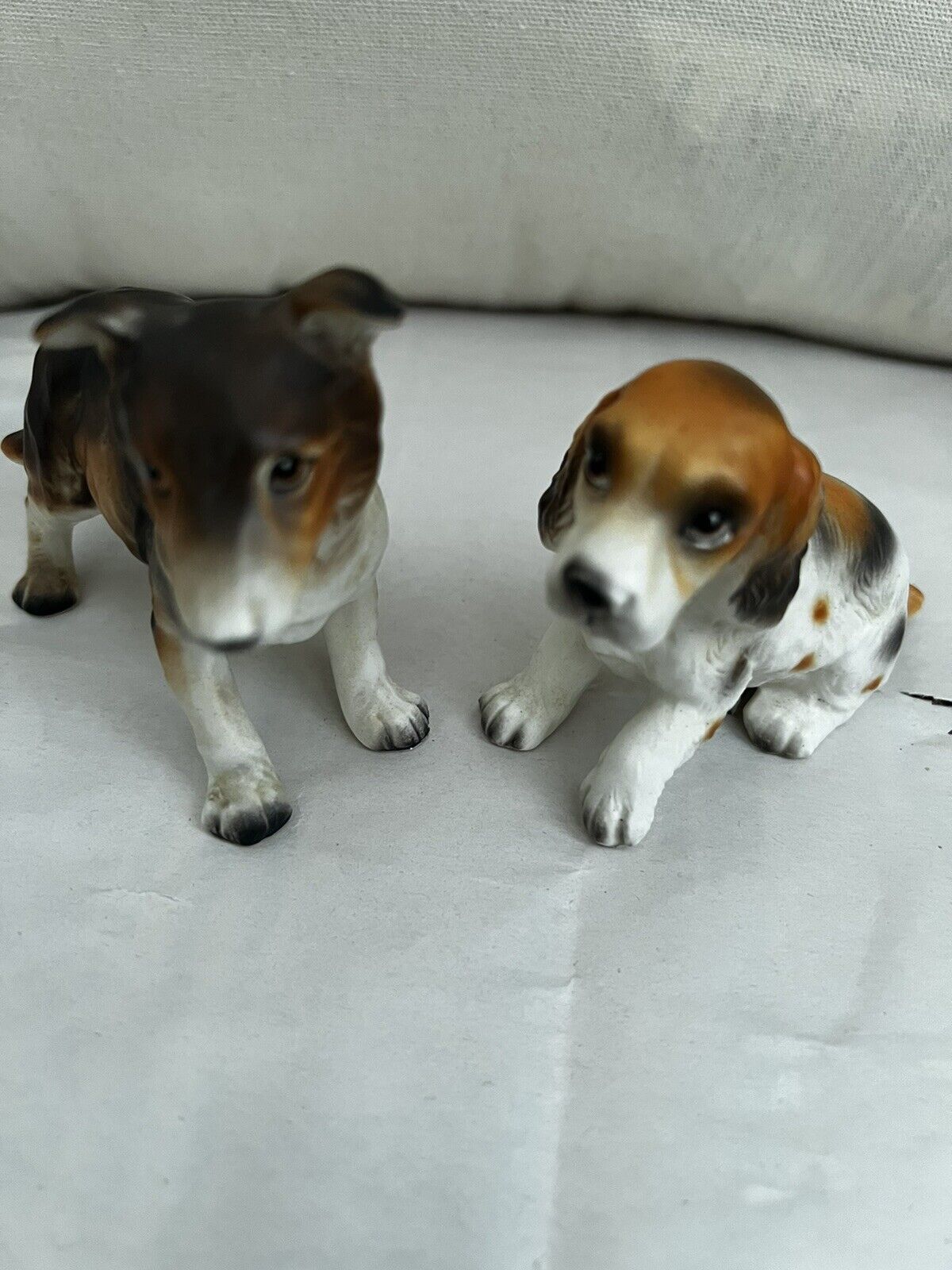 Two Dog Figurines Both Are Numbered