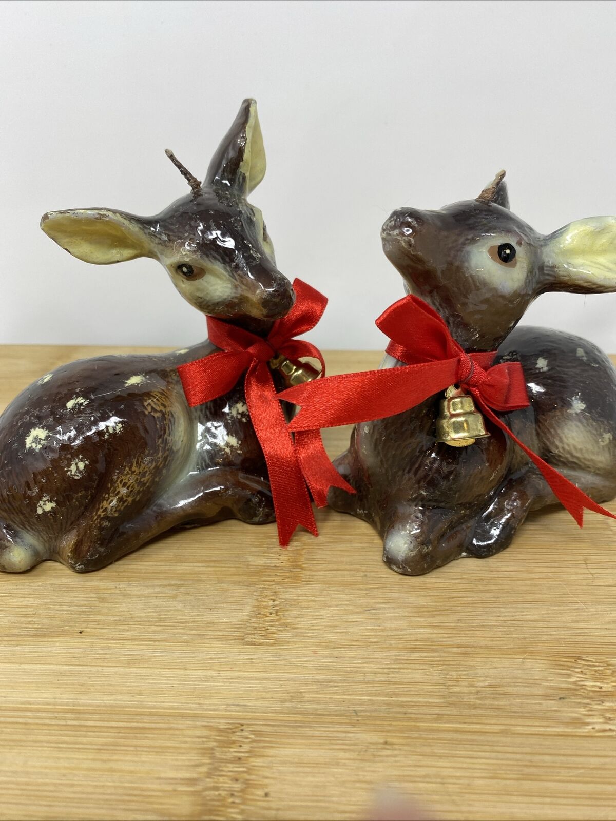 Set Of 2 Vintage Deer Candles Spotted Sitting Does Red Ribbon Gold Bells