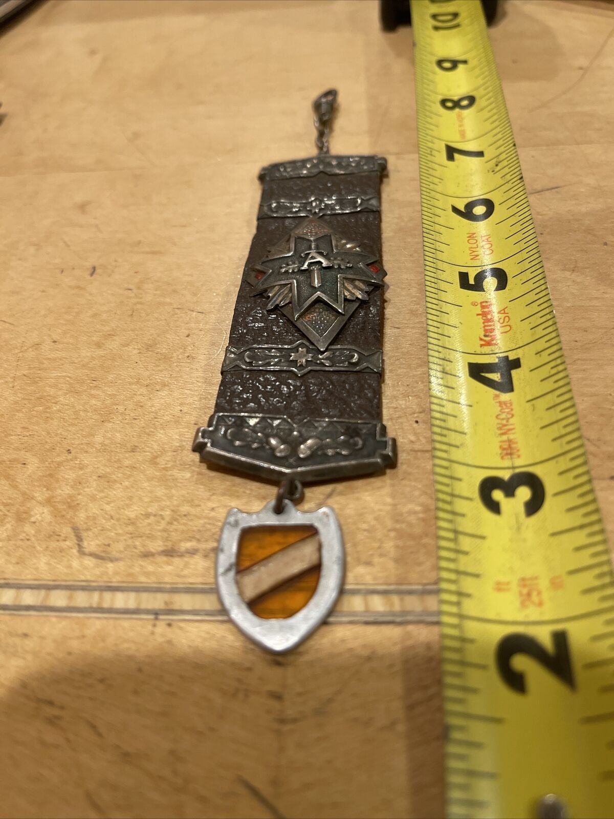 LATVIA.WWI,MILITARY SILVER BADGE ON LEATHER WITH SILVER DECOR,REGIMENT UNKNOWN.