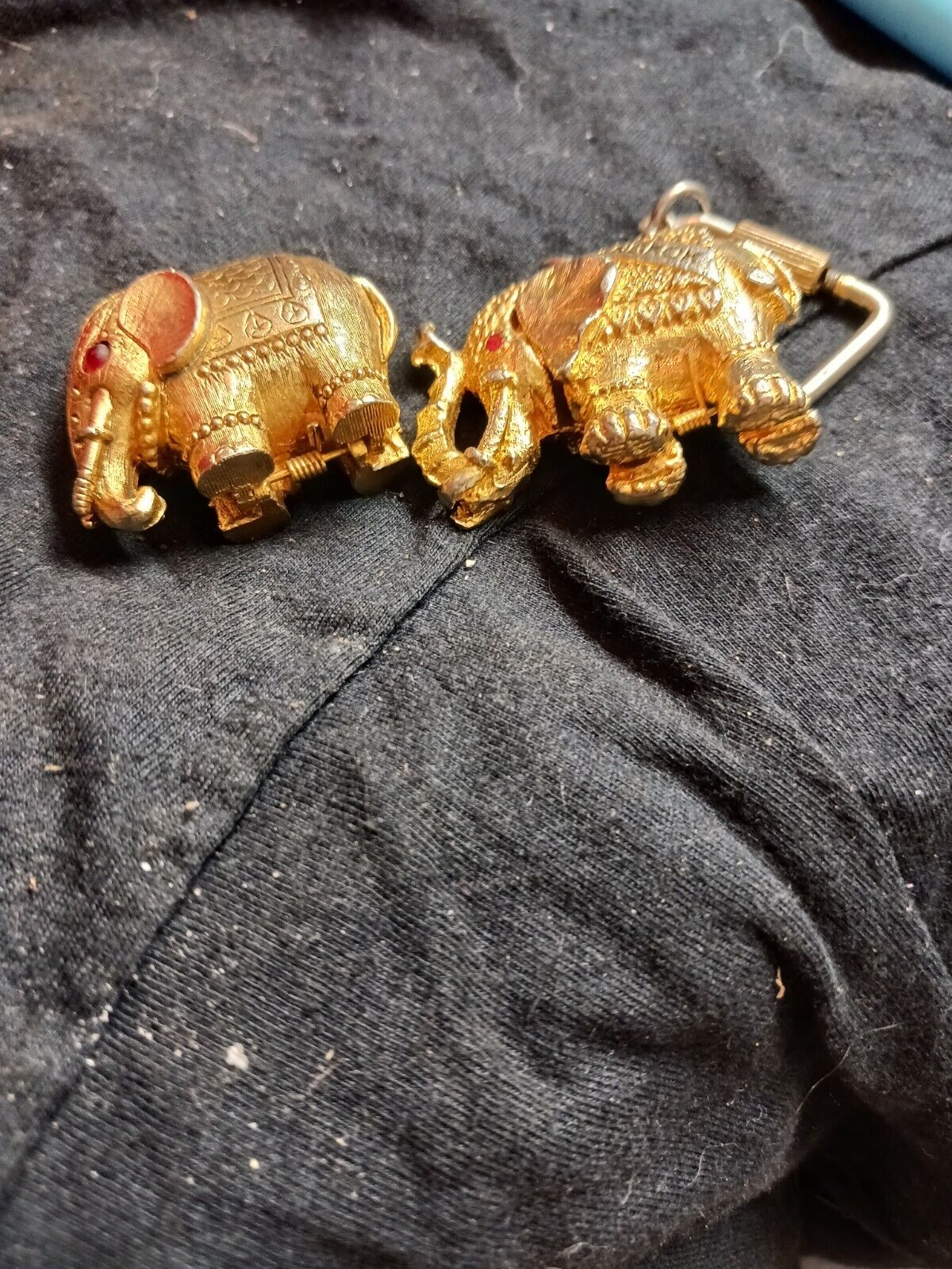 Two Vintage Small Gold Elephants. One Is A Max Factor Perfume Elephant And...