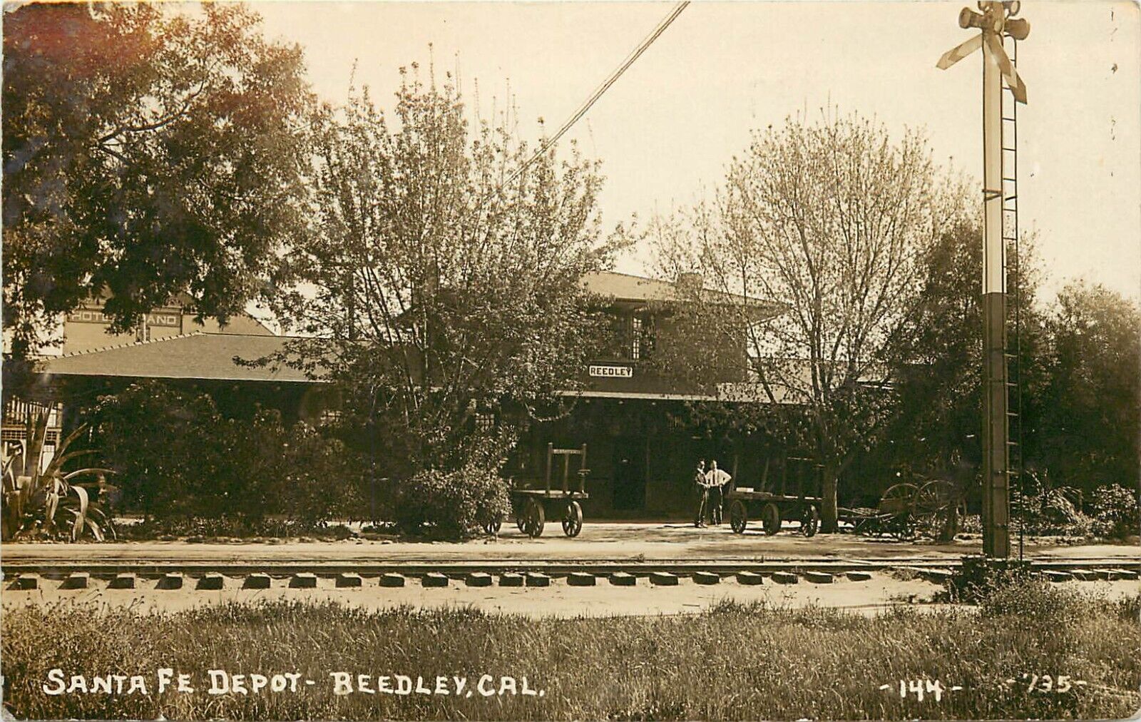 George Besaw RPPC 144. Santa Fe Depot, Reedley CA Fresno County Posted 1911
