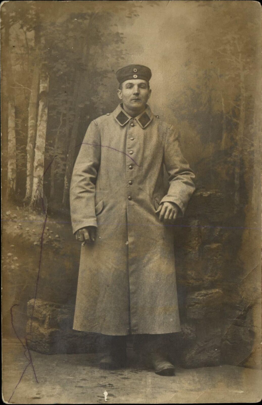WWI German soldier studio portrait trench coat ~ RPPC real photo postcard