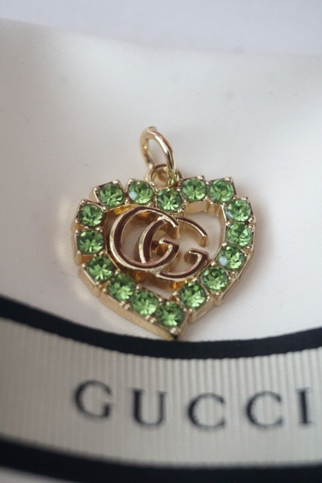 One Gucci  zipper pull 1 inch   GG logo   metal gold / green