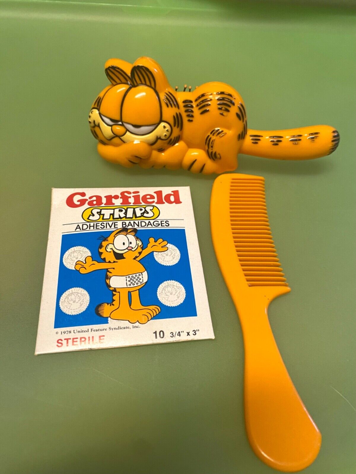 Vintage 1978 Garfield Brush & Comb Set, and pack of bandaids New