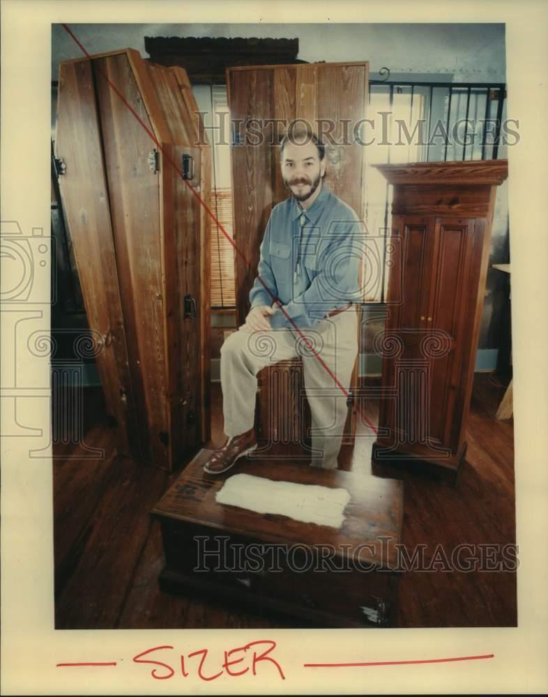 1993 Press Photo David Pipes stands in front of his line of furniture he makes