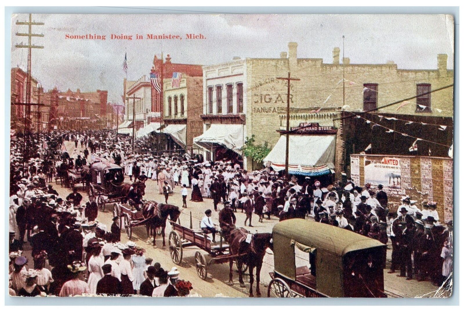 1912 Something Doing Crowd Horse Carriage US Flag Manistee Michigan MI Postcard